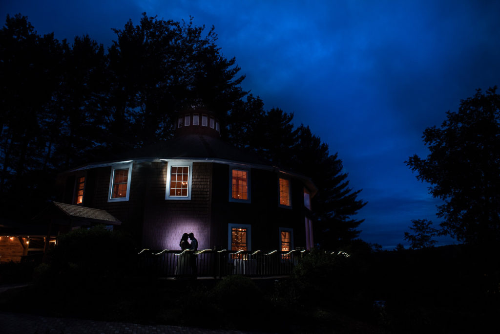 silhouette of bride and groom in vermont wedding barn