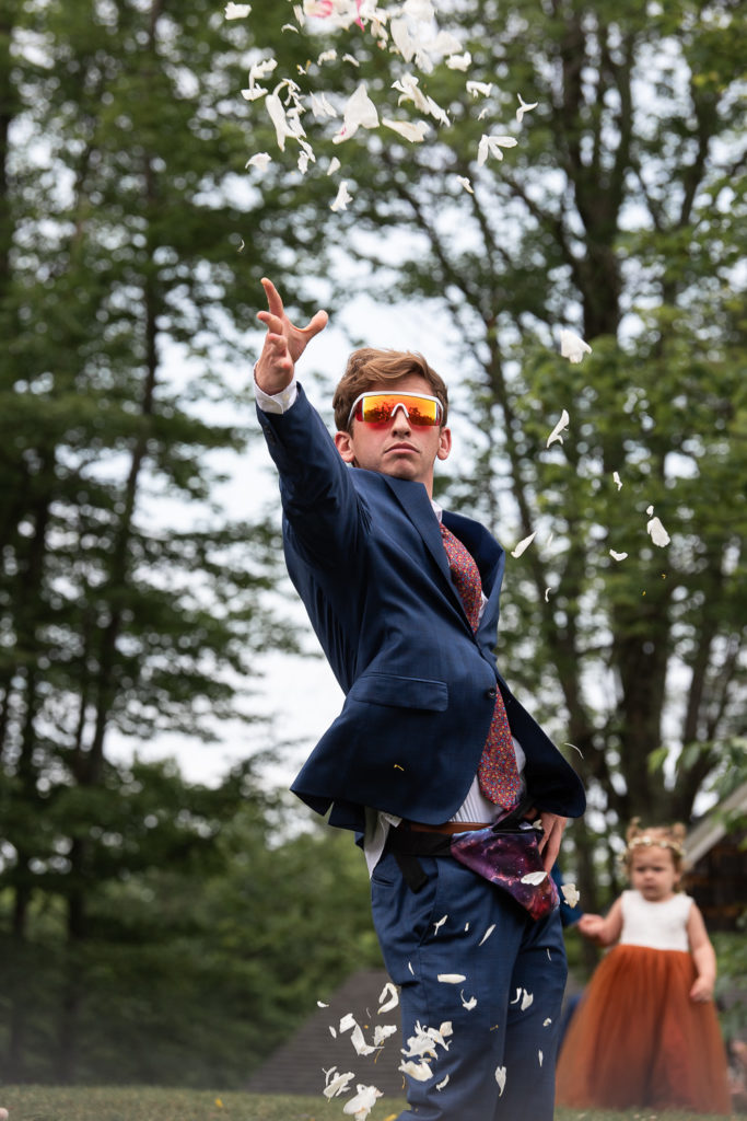 boy tossing flowers